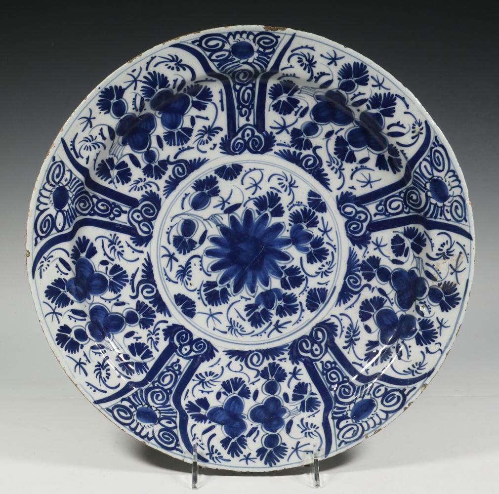 EARLY DELFT CHARGER: 18th c. Dutch Blue & White Delft Charger, with floral and paneled decoration, 14" diam. Rim glaze frits.