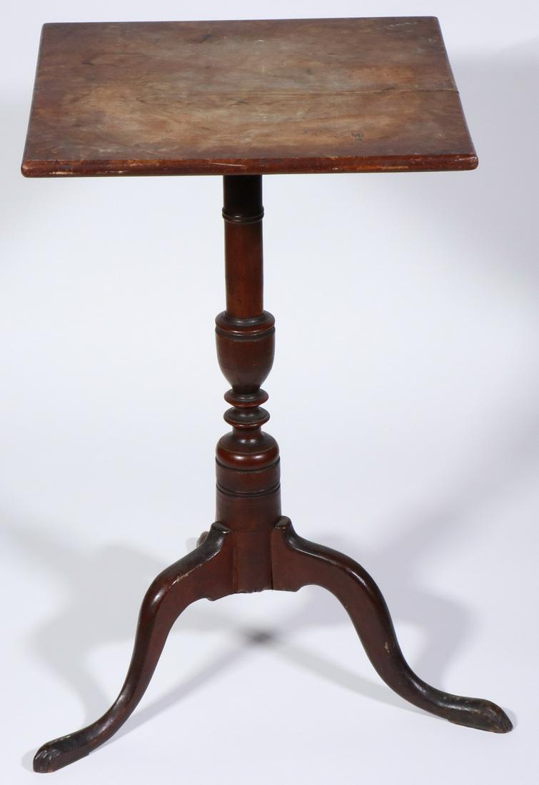 SQUARE TOP COUNTRY CHERRY CANDLESTAND: Thin bullnose rigid top, set on a ring and urn turned column raised on a tripod base of high arched legs ending in snake feet, 25 1/2" tall, 15 1/2" x 15" top, 19" leg to leg. Wear and shrinkage crack