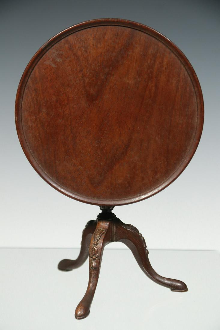 MINIATURE TILT TOP DISH TOP TEA TABLE: Finely Crafted Doll House Size Birdcage Top Tea Table, dish top and tilt top, with carved urn pedestal and tripod base, cabriole legs with carved knees and pad feet, 5" high, 5" diam. Chip to pedestal