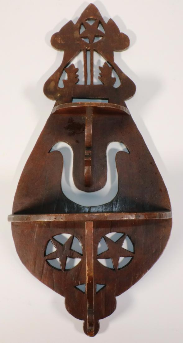 19TH C. AMERICAN FOLK ART WALL SHELF: Two-Tiered Painted Wood Shelf with fretwork backplate and brackets, demilune shelves, featuring four stars and a lyre, 27" x 13" x 6 3/4". Good condition.