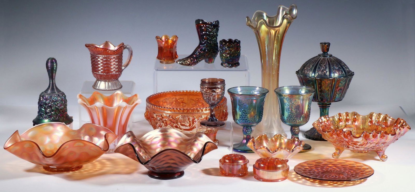 (19 PCS) CARNIVAL GLASS: Lot of (19) Pieces of Carnival Glass, assorted patterns and makers, (12) Pieces in marigold, incl: (2) footed bowls, (3) ruffled rim bowls, (1) plate, (1) jug, (2) flower frogs, (1) toothpick holder,