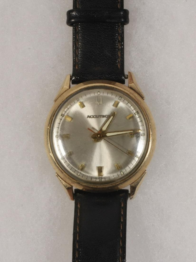 BULOVA GENT'S WRISTWATCH: Vintage Bulova Accutron Wristwatch with 10K gold filled round head and sweep second hand, serial #A365330 M6. Recently serviced, with black calfskin band.