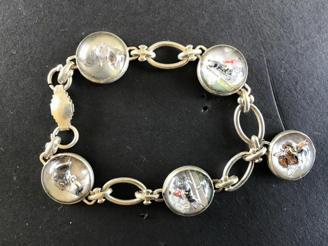 INTAGLIO BRACELET: Vintage Child Size Sterling Bracelet, with(5) round intaglios depicting fox hunting scenes and dogs, 6" overall length. Signs of wear on tops of crystal intaglios.