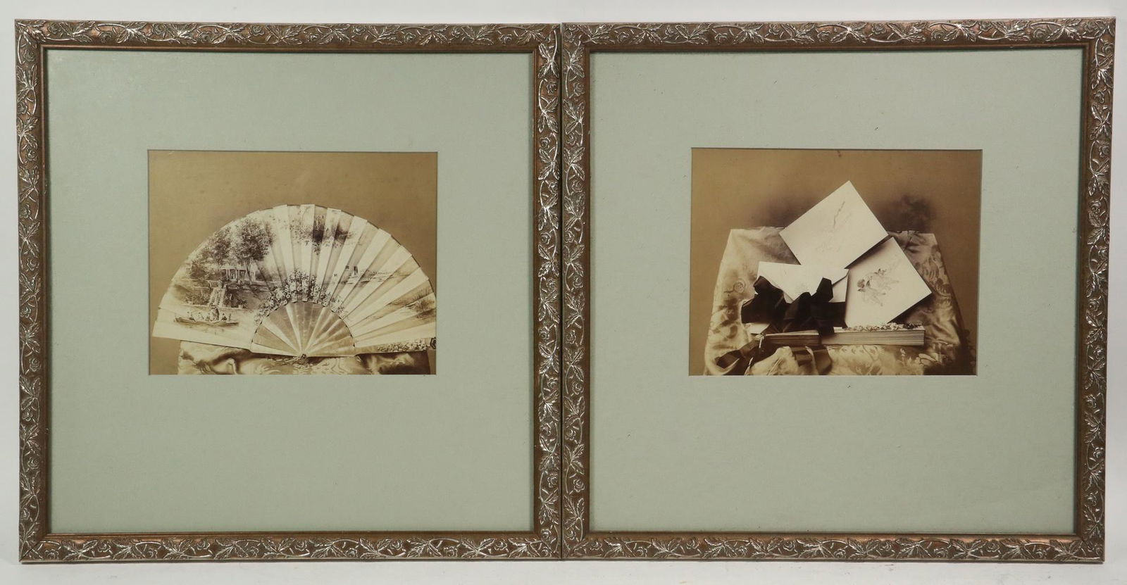 (2) FRAMED VICTORIAN ALBUMEN ART PHOTOS: Art Photos of a French Painted Hand Fan and Love Letters, in matching silver ivy patterned frames, matted and glazed, OS: 16 1/4" square, SS: 6 3/4" x 8 1/2". Good condition.