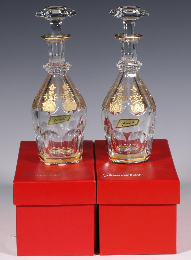 PR BACCARAT HARCOURT EMPIRE CORDIAL DECANTERS: Pair of Baccarat French Crystal Stoppered Decanters, 8 3/8" high, with gold decoration, one with affixed Baccarat gold foil label, in original red Baccarat boxes, box: 4" high, 9 1/4" x 4 1/4". Good c