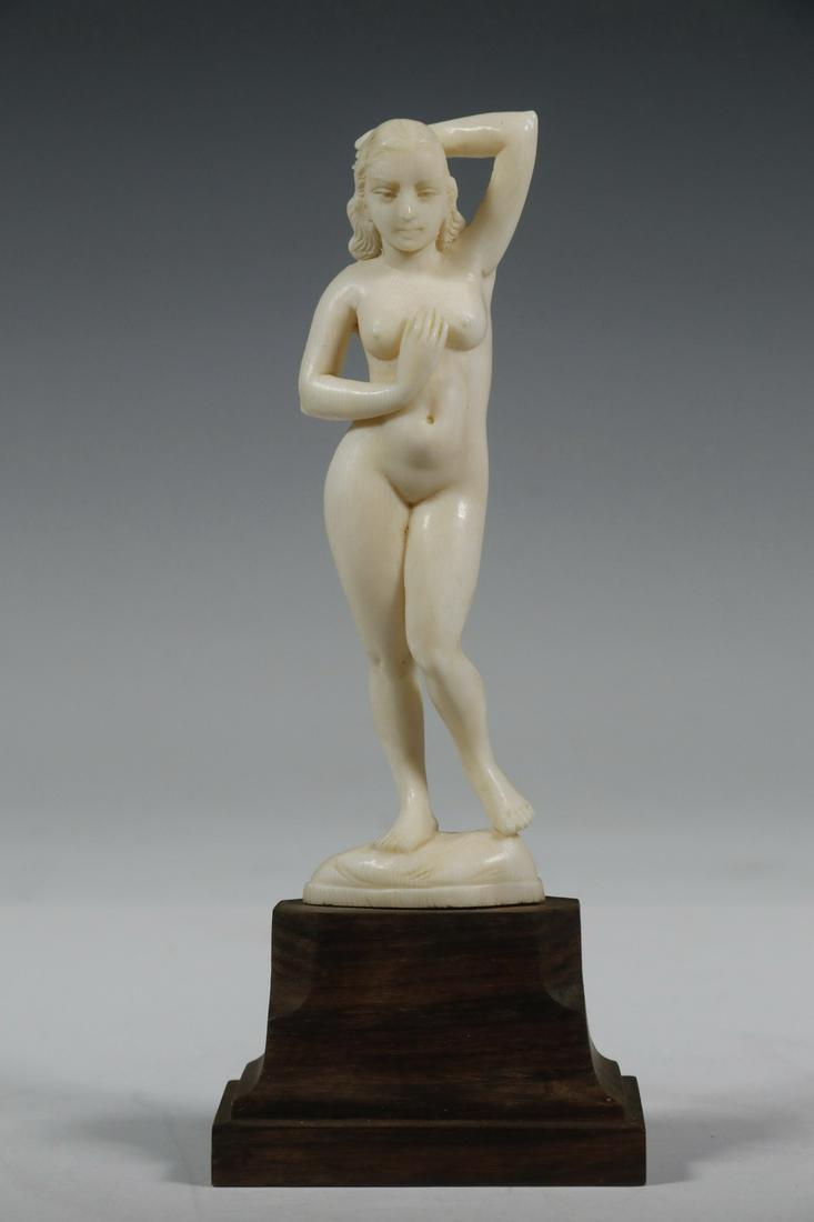 LATE 19TH C. CONTINENTAL CARVING ON WOODEN BASE: Nude Woman in a Seductive Standing Pose, probably German, unsigned, mounted on a shaped rosewood plinth with a collector's number on back, 6 3/4" tall. Good condition.
