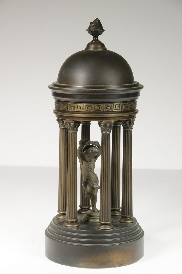 EDWARDIAN BRONZE DESK ORNAMENT: Six-Column Roman Temple, based on the round circular temple dedicated to Diana (Tempio di Diana) at the Villa Borghese Gardens, Rome, Italy, although this has a dancing cupid in the center. 12" x 5" d