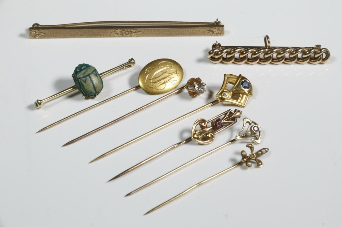 (9) STICKPINS & BAR PINS: (9) Piece 14K and 10K Yellow Gold Pin Lot, incl: (6) Assorted stickpins, most set with small stones or seed pearls, 2 1/8 to 2 3/4" long; and (3) Bar pins, one with carved scarab, 1 5/8" to 3" wide; 1