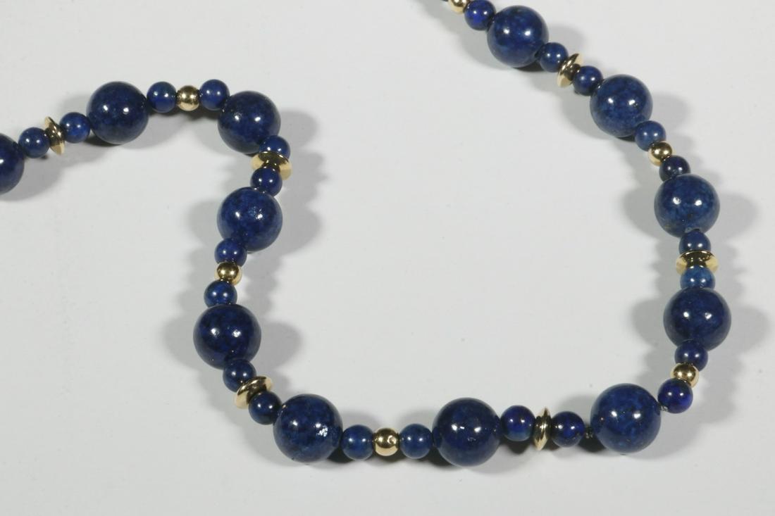 LAPIS LAZULI NECKLACE BY SAM SHAW (NORTHEAST HARBOR,: Lapis Lazuli and Gold Bead Necklace, by artisan Sam Shaw of Northeast Harbor, Maine, in velvet covered case (6" x 4" x 1"), 30 1/2" long. Good condition.