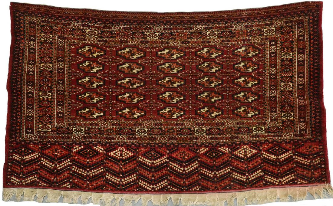 TEKKE TORBA (CARGO BAG) - 2'-6" x 4'-3": West Turkestan, early 20th c., (25) 'Chuvel' style guls in ivory, mahogany, midnight blue and red on the mahogany field, multicolor octagon border and serrated leaf and diamond border at bottom. Good