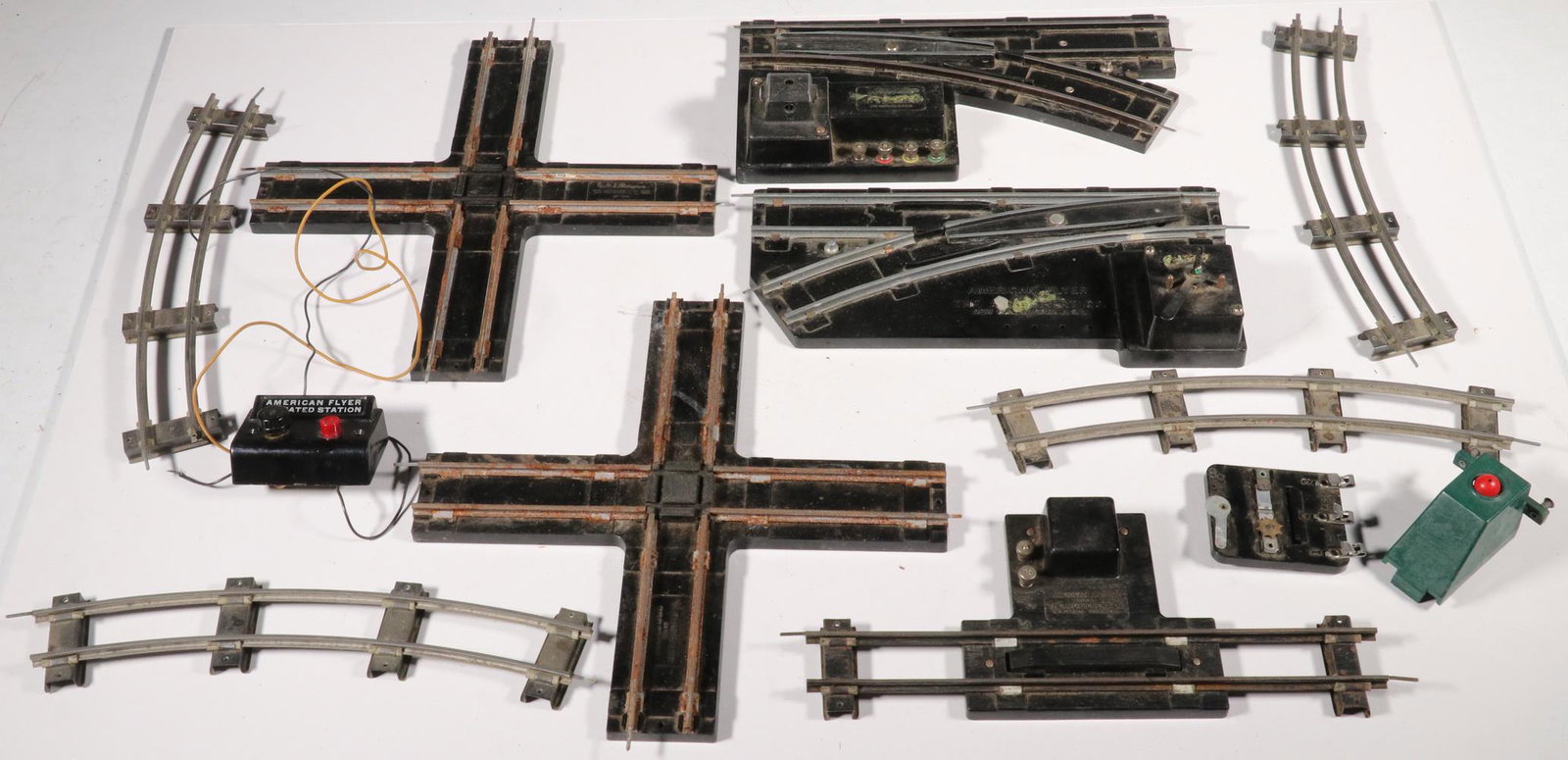 BOX OF AMERICAN FLYER MODEL TRAIN TRACK ITEMS: Large Box of S-Scale Track Accessories, incl: (65) pieces of curved track; (39) pieces of straight track; (11) pieces of short track; (3) cross-over tracks; (4) track switchers; (1) uncoupler; and a s
