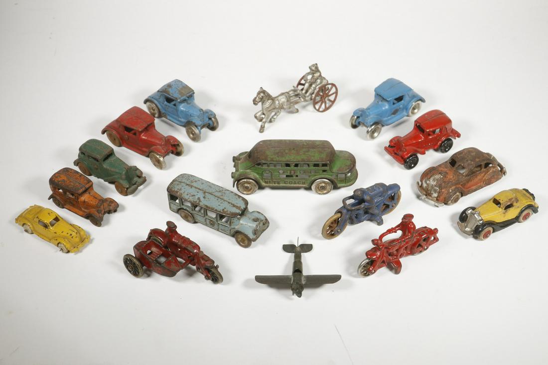 (16) VINTAGE METAL TOY VEHICLES: Collection of (16) Assorted Early 20th c. Toy Vehicles, mostly iron, incl: Sulky horse cart and rider, 4 3/4" long; (3) Motorcycles with riders, one with side car, 3 3/4" to 4 1/4" wide; (2) Buses, Ni
