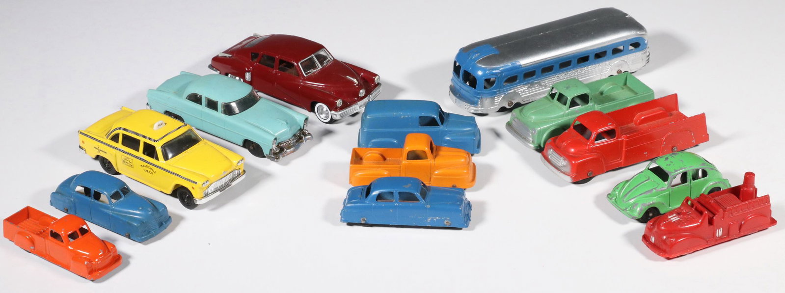 (13) VINTAGE TOY VEHICLES: Group of (13) Assorted Vintage Toy Vehicles, most die-cast metal, incl: Tootsie Toy Greyhound bus, 6" long; (6) Other Tootsie Toy die-cast cars and trucks, 3 1/8" to 4 1/4" long; Lionel plastic sedan 