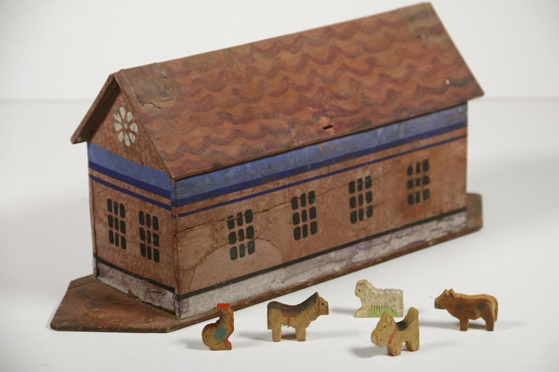 GERMAN NOAH'S ARK: Late 19th c. Noah's Ark, in painted wood, with tape hinged lid, five wooden animals inside, 5 3/4" high, 14 1/4" x 4". Surface wear, paint losses, side shrinkage crack.