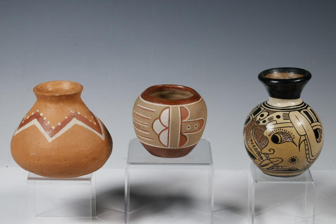 (3) SMALL LATE 20TH C. SOUTHWEST PUEBLO POTTERY: Including: Red Clay Squat Jar with white and red zigzag decoration, 4 1/2" x 4 1/2" diam.; Red Clay Spherical Jar with carved three-color decoration, 3" x 3 1/2"; PLUS Mexican Pot with flared neck and