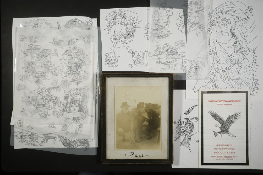 COLLECTION OF 100S OF PCS OF TATTOO ARTWORK BY TATS: 1970s to early 90s work, including some Viet Nam, photos of the artist at work and play, mostly well drawn, on tracing paper, some copies. Includes framed photo of Tats Tommy with a pal and guns.