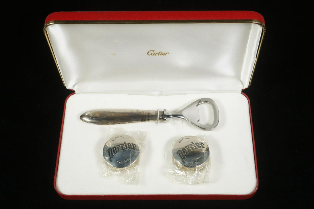 CARTIER STERLING SILVER PERRIER OPENER & BOTTLE CAPS: Set of Perrier Branded Sterling Silver Bottle Opener and Bottle Caps by Cartier, in a fitted Cartier presentation case, hollow handle opener, bottle caps are new in cello packaging, opener: 5 1/8" lon