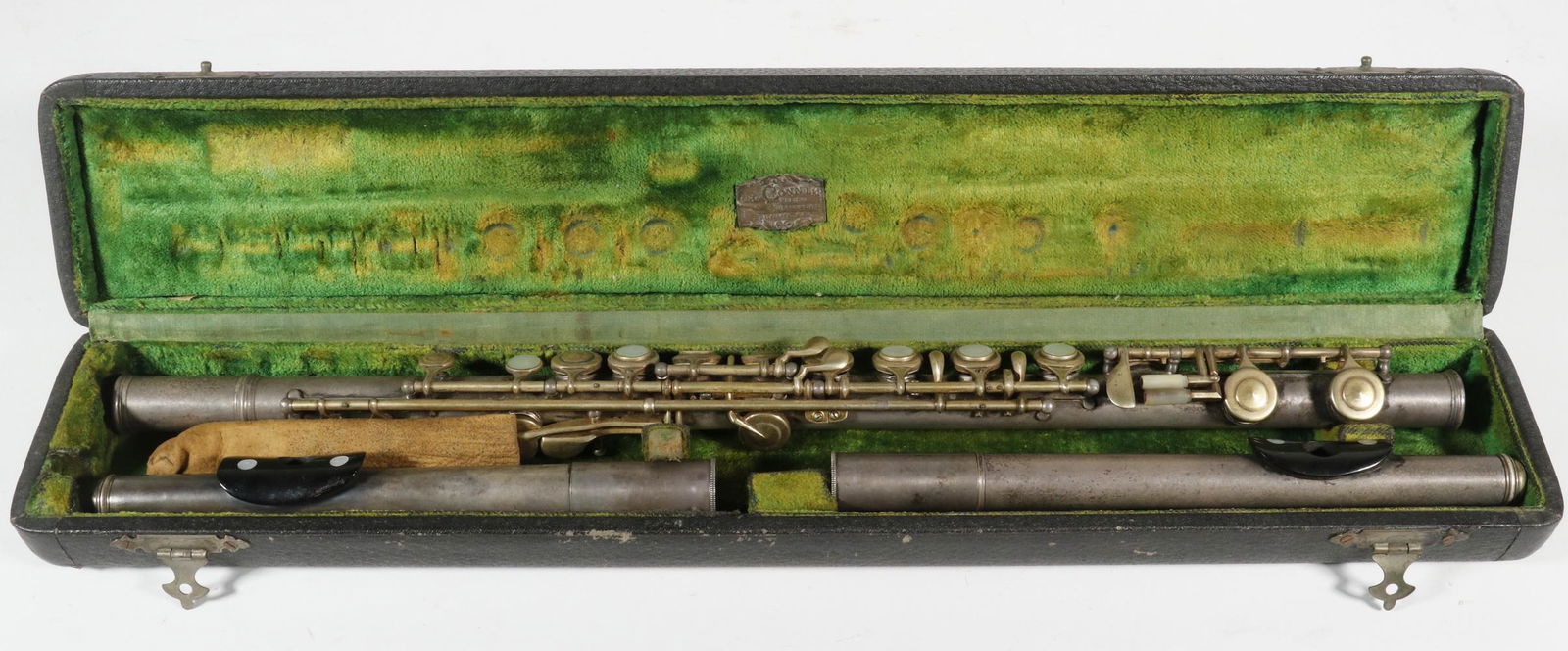 1899 CONN FLUTE IN CASE: Silver-Plated Flute, engraved "Made by C.G. Conn, Ltd., Elkhart, Ind., USA", s/n 55150 (manufactured in 1899), with mother-of-pearl keys, two mouthpieces having guttas percha lip rest, in the original