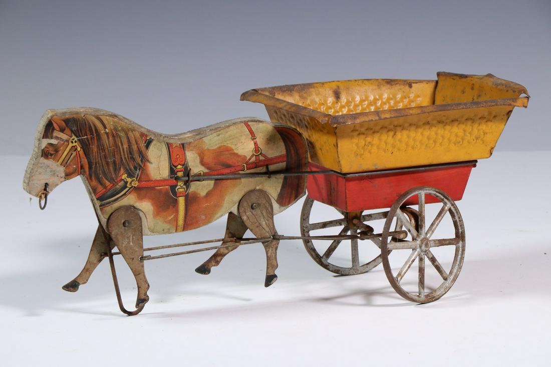 ANTIQUE GIBBS MFG. ENGLISH PONY CART TOY: Circa 1915 Wood, Tin and Paper Litho Horse and Wagon Toy by Gibbs Mfg. Co. (Canton, OH), pony with articulated legs pulls a yellow and red painted cart, his legs move when the cart wheels turn, 5 1/4"