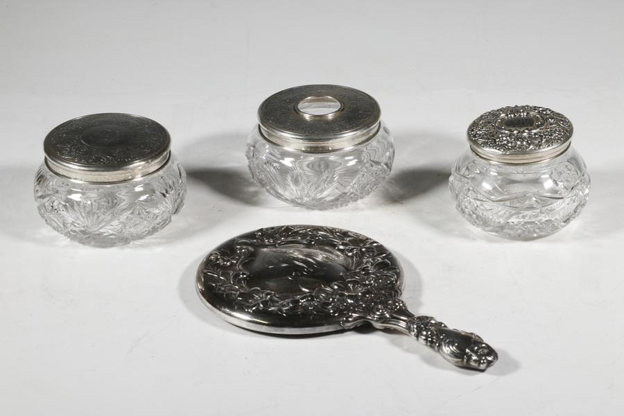 (4) SILVER VANITY ITEMS: Collection of (4) Early 20th c. Dressing Table Accessories, incl: Whiting Lily pattern hand mirror, #7071, with beveled mirror, GR monogram, 9 1/2" x 5 3/4", minor silvering losses; (2) Sterling toppe