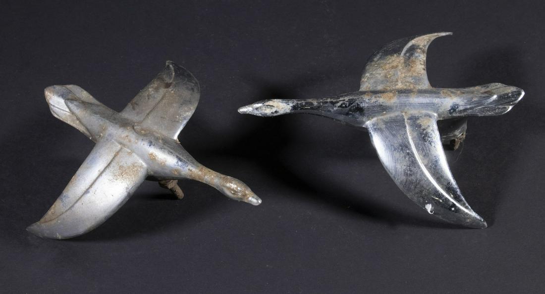 PR FLYING GOOSE FORM HOOD ORNAMENTS: Pair of Circa 1940s Automotive Ornaments, sleek chrome plated design with aerodynamic wings, 3 1/4" high, 7 5/8" x 6 1/4". Chrome losses, surface corrosion.