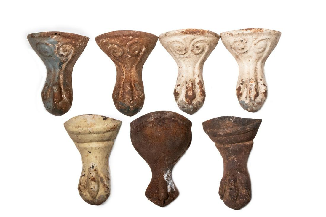 (7) CAST IRON CLAWFOOT TUB FEET: Lot of (7) Victorian Iron Clawfoot Tub Feet, incl: Set of (4) with relief molded heart decoration and ball and claw foot, 6 3/8" long, 4 5/8" wide; (2) Matching feet, each with raised folded decoratio
