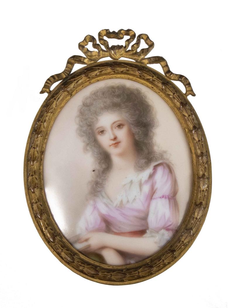 FRENCH ENAMELED PORCELAIN MINIATURE: After the Portrait of The Princess of Lamballe by Élisabeth Louise Vigée Le Brun (1755-1842). Ca. 1920s. In a gilt bronze oval frame, 4 1/4" x 3" overall. Very good condition.