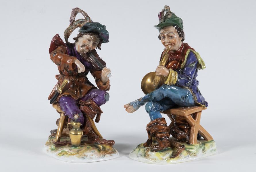 (2) ERNST BOHNE & SOHNE GERMAN MUSICIAN FIGURINES: Lot of (2) Early 20th c. German Porcelain Figurines by Ernst Bohne & Sohne, Rudolstadt Volkstedt, both with blue crowned N mark on base, incl: Horn player, 7 3/4" high, hat chips; and Violinist, 7 1/2