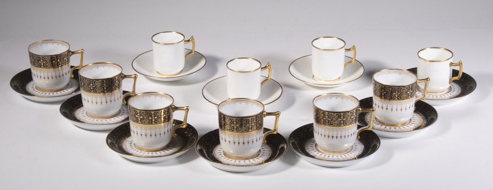 (20 PCS) EUROPEAN PORCELAIN DEMITASSE CUPS & SAUCERS: Lot of (20) Late 19th - Early 20th c. Demitasse Cups & Saucers, incl: (7) Mintons molded cream colored porcelain with gilded rims, Mintons mark and 'Made for A.B. Daniell & Sons, Wigmore St., London' 