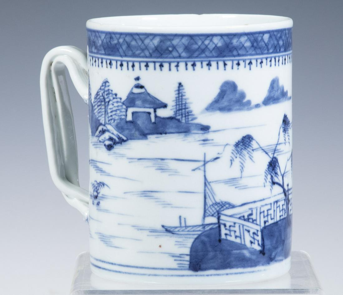 CHINESE BLUE & WHITE PORCELAIN TANKARD: 18th c. Cylindrical Mug, with landscape and pagodas decoration, twist form handle with embossed foliate terminals, 5 1/8" high, 5 3/4" x 4 1/4". Two top rim chips.