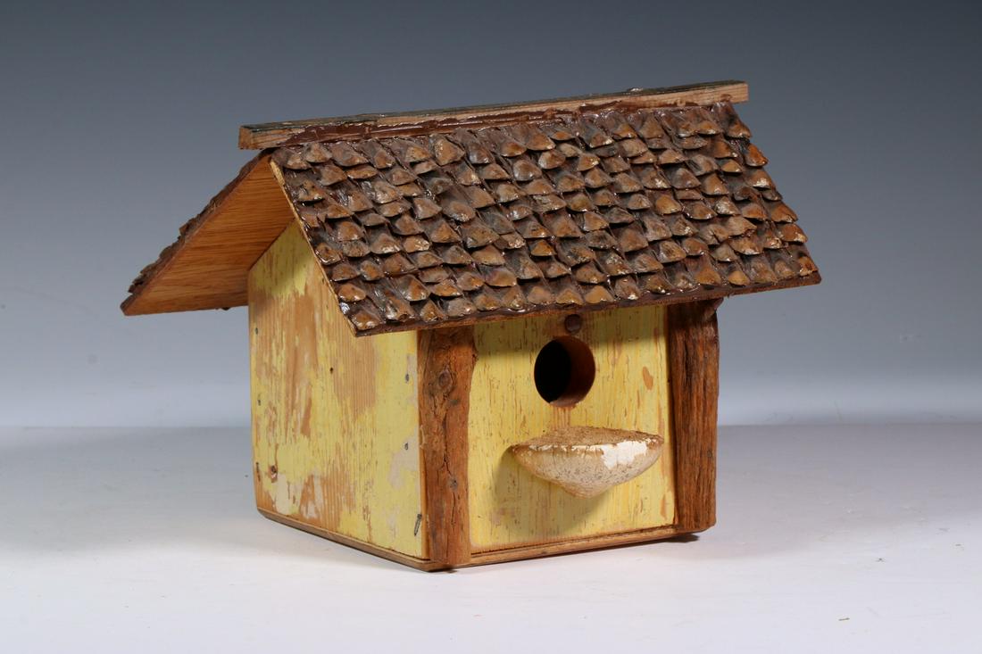 PAINTED BIRD HOUSE: Folk Art Hand Crafted Bird House, with acorn roof, painted sides, and fungus perch, base stamped 'Hand Crafted at Brown's Foster Home, Gardner, ME, #67A, MP, 2000', 7 1/2" high, 9 5/8" x 8 3/4". Good 