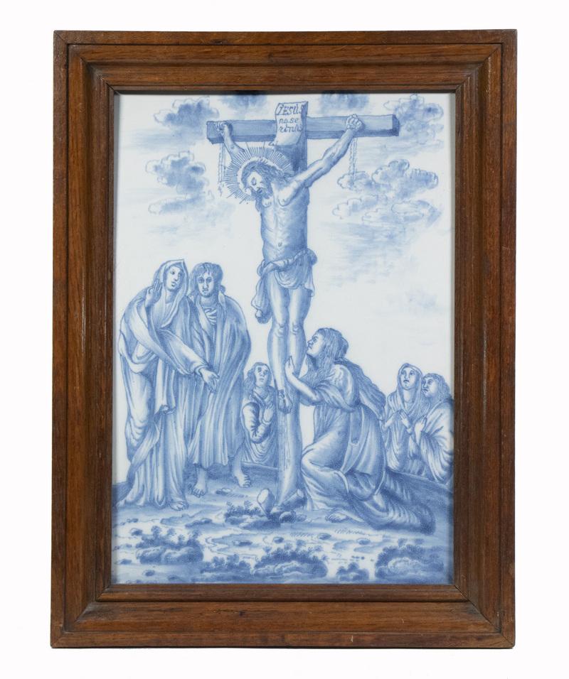 FRAMED CONTINENTAL CERAMIC TILE DEPICTING THE CRUCIFIXION: Framed Blue & White Tin Glazed Tile, possibly Spanish or Portuguese, depicting Christ on the cross surrounded by Mary Magdalene and other followers, in a molded oak frame, tile: 17" x 12", OS: 20 3/8"