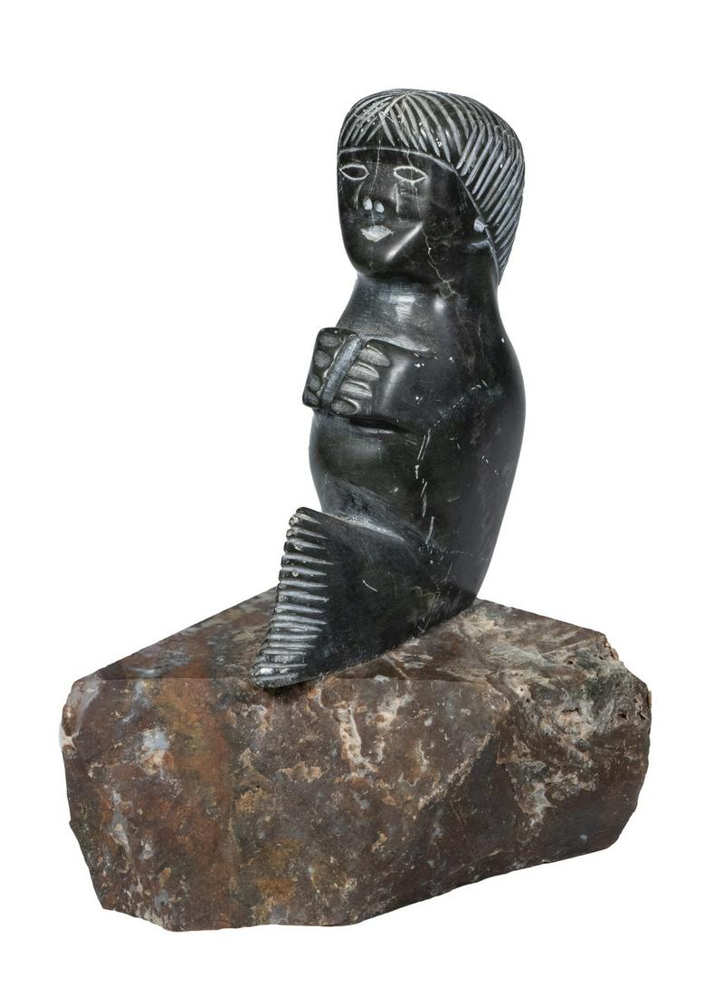 INUIT CARVED FIGURE: Carved Soapstone Transformational Figure, depicting a seal with human head, mounted on a marble base, unsigned, 7 1/4" high, 4 1/4" x 4 1/4" . Surface scratches.