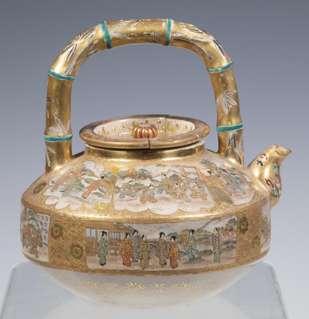 JAPANESE SATSUMA TEAPOT: Meiji Period Porcelain Teapot, with finely painted figural decoration, faux bamboo handle, lid with chrysanthemum form finial, black and gold maker's mark on base, 5" high, 4 1/2" x 4 1/4". Repaired l
