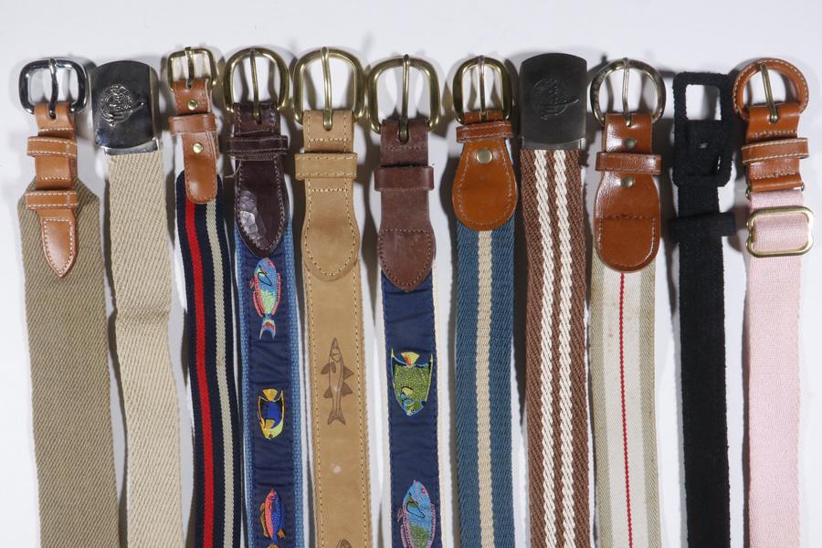 (11) WOMEN'S BELTS: (1) Lacoste blue and white striped canvas leather belt with gold tone hardware, 36"; (2) Striped elastic and cotton belts, size 26" & 32"; (2) Mobaco cotton belts, 35" & 40"; (2) Cotton and leather be