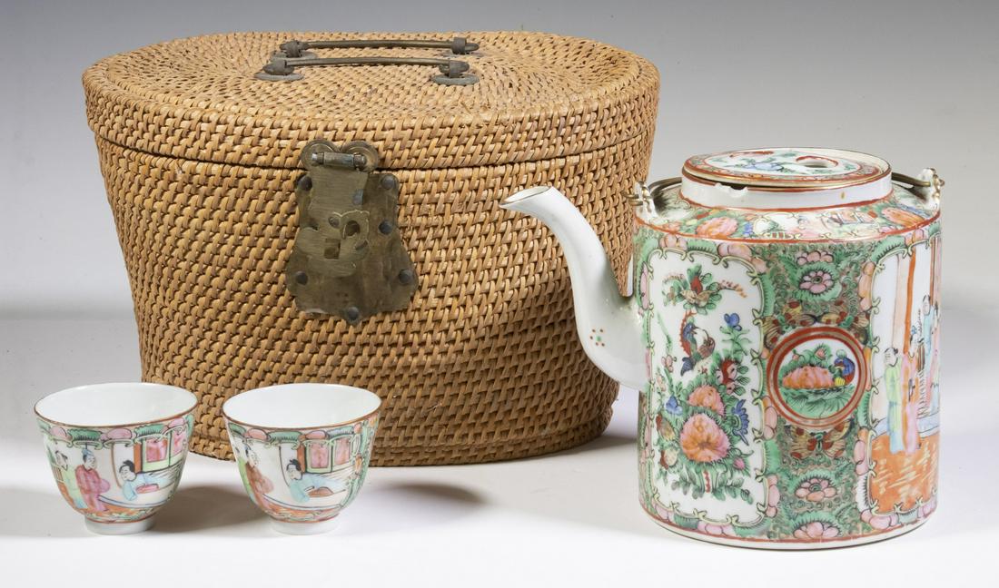CHINESE EXPORT TEAPOT SET IN BASKET: Early 20th c. Rose Medallion Teapot and (2) Matching Cups, all marked 'Made in China", in a fitted woven basket with front latch and top carry handles, teapot: 6 1/4" high, handleless cups: 2 1/8" hig