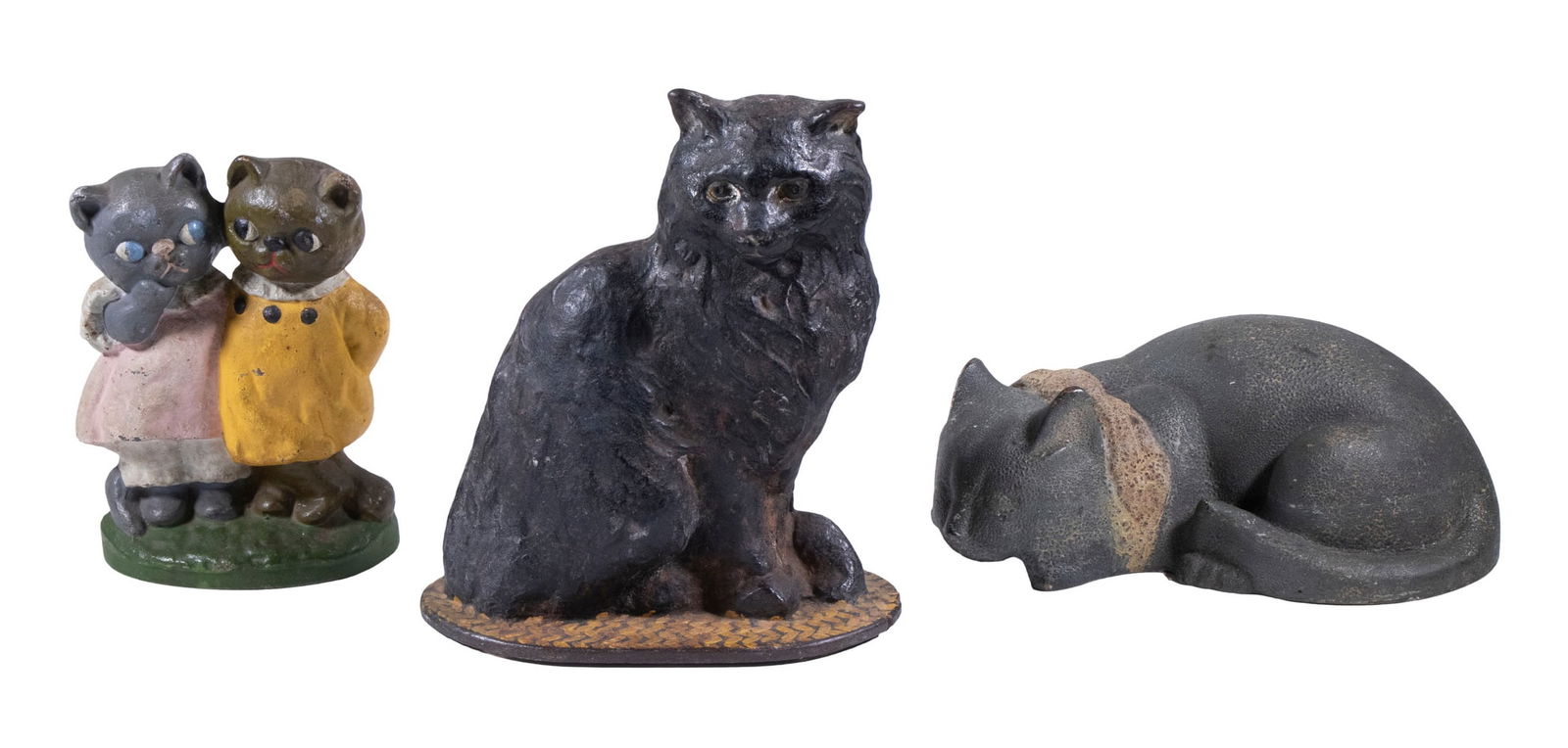 (3) VINTAGE CAST IRON CAT DOORSTOPS: Including: Hubley "Twin Kittens", 7" high, 5" wide, repainted surface; Seated Persian cat, 8 1/2" high, 7 1/2" wide; and Circa 1920 recumbent sleeping cat, 3 1/2" high, 9" wide.