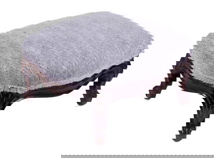 VICTORIAN ROSEWOOD FOOTSTOOL: 19th c. Low Serpentine Stool, with shaped and carved frame, new grey fabric upholstery top, 8" high, 14" x 13".