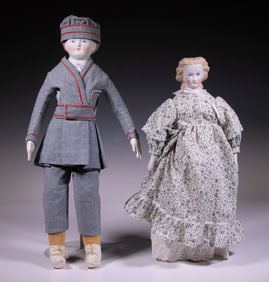 BISQUE HEAD BOY AND GIRL DOLLS