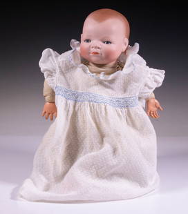 GRACE S. PUTNAM "BYE-LO-BABY" BISQUE HEAD DOLL: 1920s Era Doll, having a bisque head with molded and painted hair, painted eyebrows and lashes, sleep eyes, closed mouth, composition hands, back of neck marked "Copr by Grace S. Putnam, Made in Germa