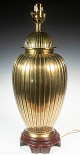 BRASS GINGER JAR FORM TABLE LAMP: Large Contemporary Asian Style Lamp, having a heavy brass base with vertical channels, set on a wooden base, single socket fixture, 22 1/2" high, 8" diam.