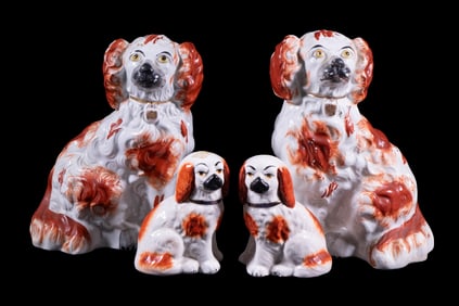(4) SEATED SPANIEL FIGURINES