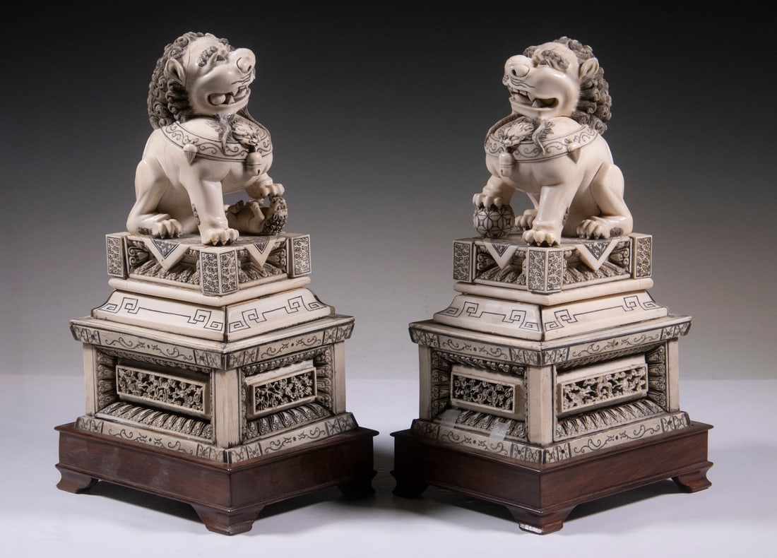 PR IVORY FOO DOG FIGURES ON WOODEN STANDS (1 of 2)