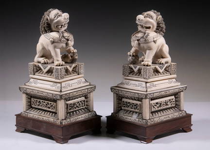 PR IVORY FOO DOG FIGURES ON WOODEN STANDS: Modern Resin Replica of Ming Forbidden City Court Guardians, on custom mahogany stands, 12" x 7 1/2" x 7" each.