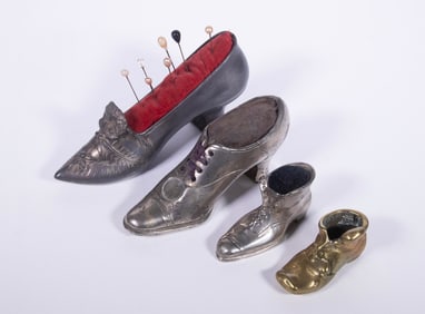 (4) METAL SHOE-FORM PINCUSHIONS AND MINIATURES, C. 1900