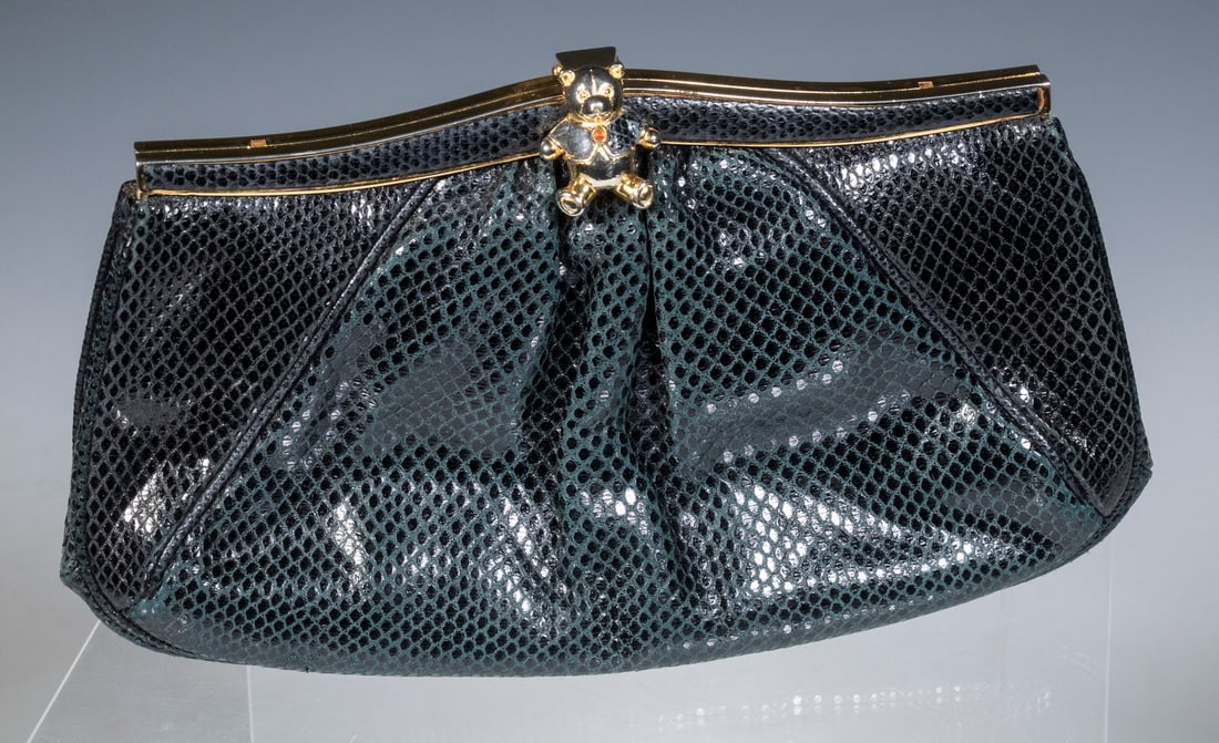 JUDITH LEIBER BLACK KARUNG CLUTCH BAG: JUDITH LEIBER BLACK KARUNG CLUTCH BAGVintage Karung Lizard Skin Purse by Judith Leiber, with teddy bear form clasp, made in Italy, optional gilt metal shoulder strap, cloth lined interior with zip clo