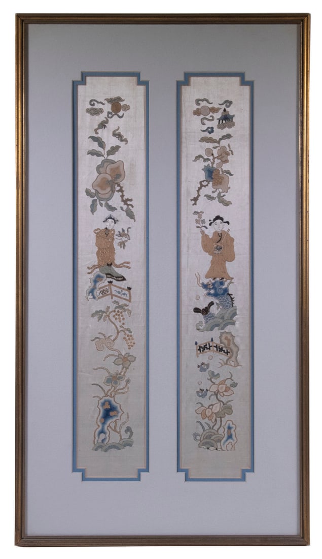 PAIR OF NARROW CHINESE SILKWORK PANELS IN ONE FRAME: PAIR OF NARROW CHINESE SILKWORK PANELS IN ONE FRAMEScholarly Figures with blossoms and symbols of fortune, silk and gold thread on tan silk, in gold molded frame with two window mat having nipped corn