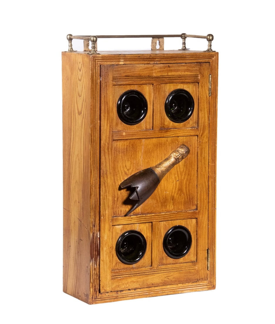 FOLK ART WOODEN WALL CABINET: FOLK ART WOODEN WALL CABINETC. 1920 Hand Crafted Hanging Cabinet, with metal galleried top and single door decorated with inset green glass champagne bottle bases and piece of cast iron in the form of