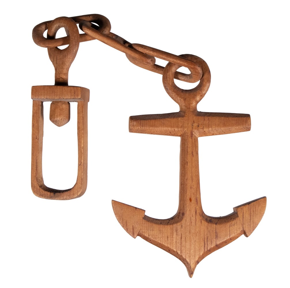 CARVED ANCHOR AND CHAIN: CARVED ANCHOR AND CHAIN Folk Art Carved Pine Nautical Carving, depicting a link chain with anchor, carved from a single piece of wood. OS: 12 1/2 x 3 1/2 in. (31.8 x 8.9 cm.)