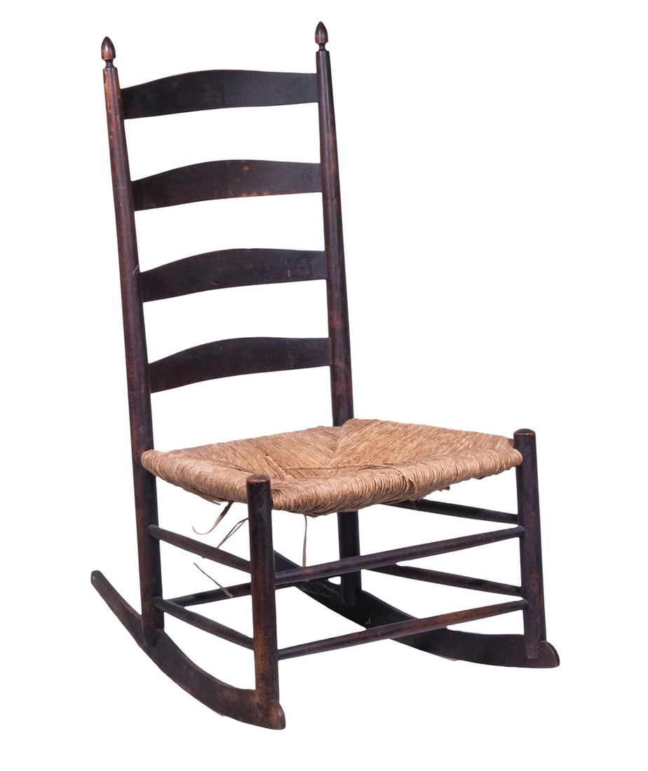 SHAKER #5 ROCKING CHAIR: SHAKER #5 ROCKING CHAIR 19th c. Dark Stained Armless Ladderback Rocker, with four slats, top slat stamped "5", rush seat. 16" high seat. Rush losses. OS: 39 x 21 x 29 in. (99.1 x 53.3 x 73.7 cm.)